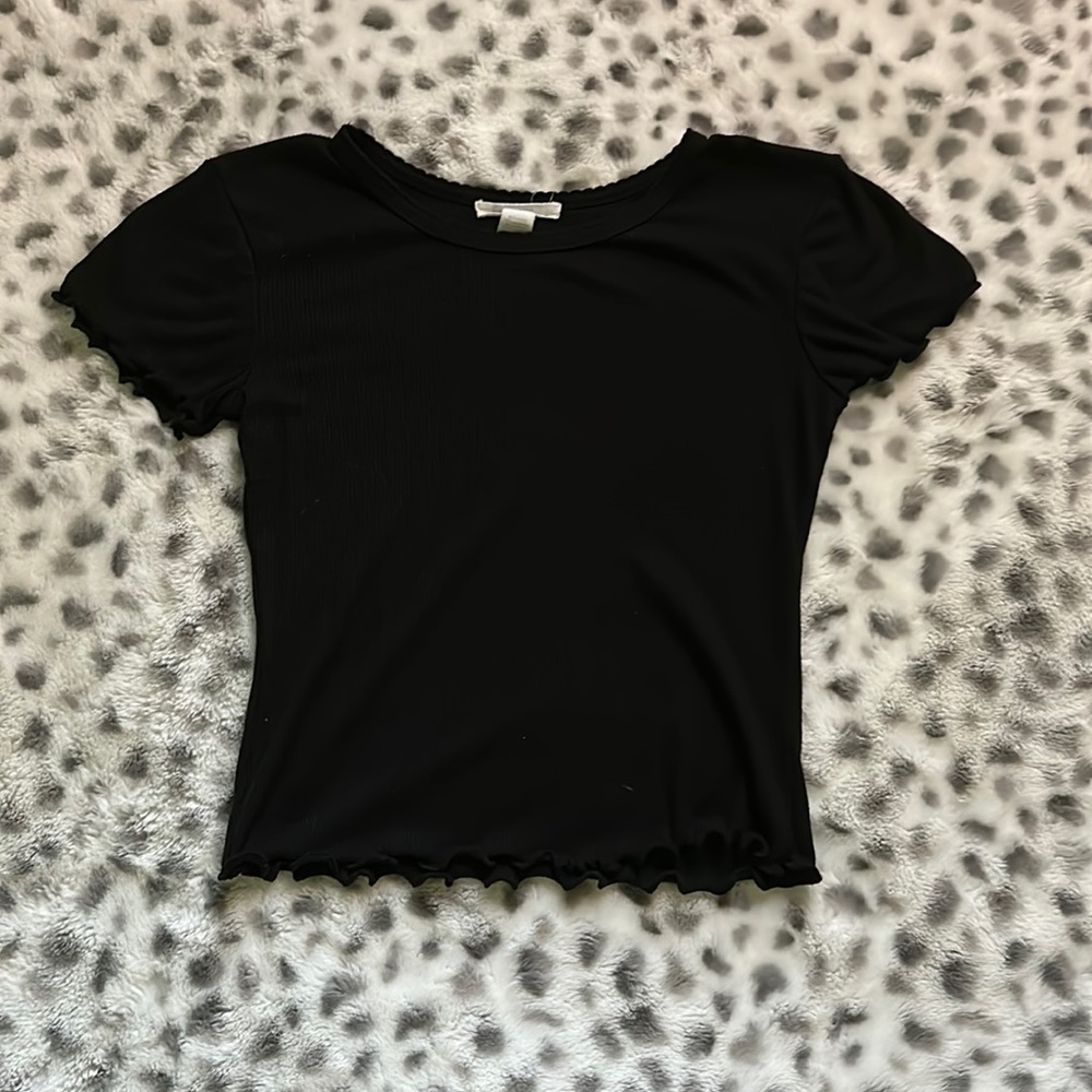 Black crop top size medium but fits like a small.